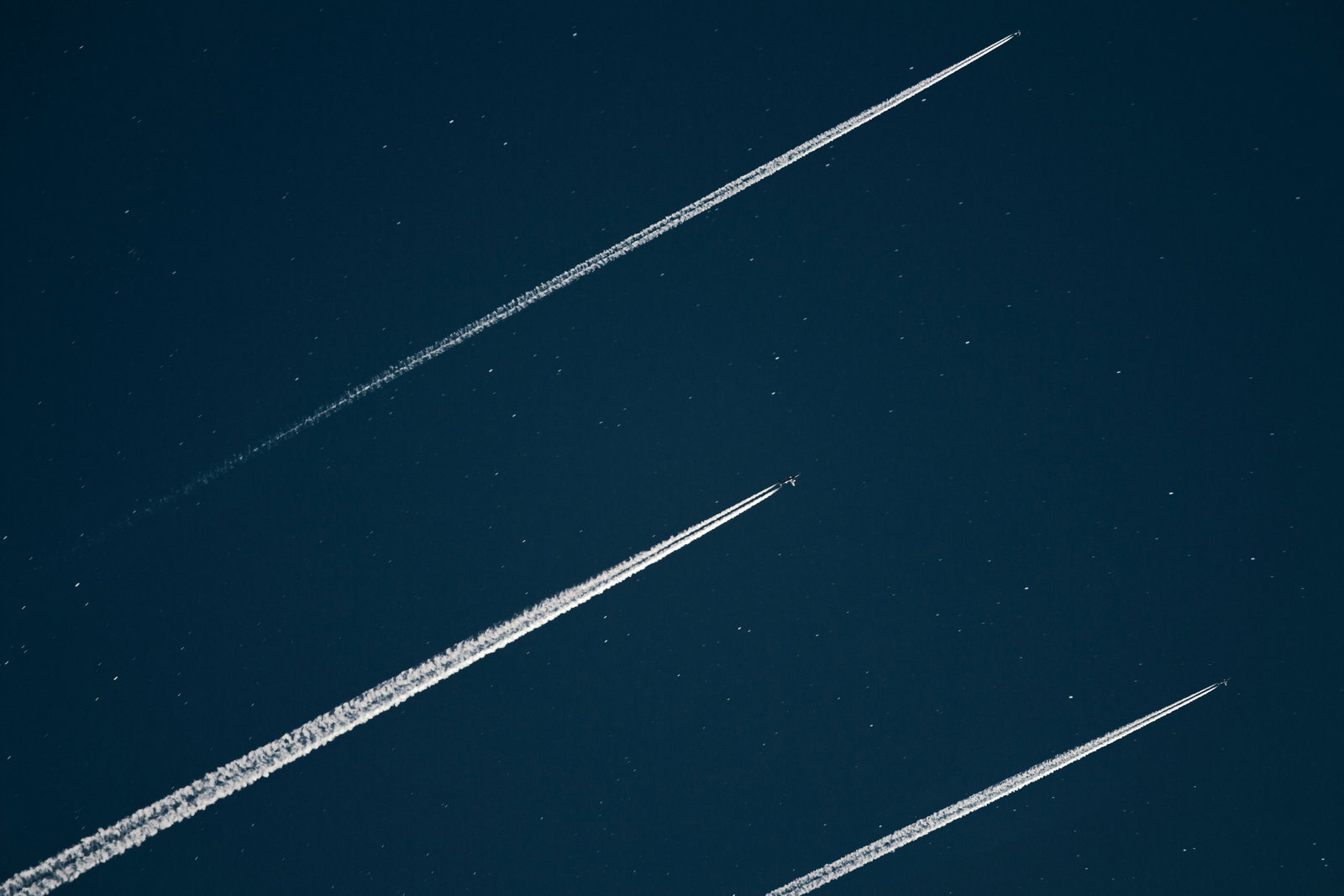 Long-exposure view of a thruster sustaining a continuous plasma plume